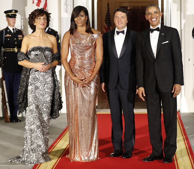 President Barack Obama and first lady Michelle Obama greet Italian Prime Minister Matteo Renzi and his wife Agnese Landini during a StateDinner at the White House in Washington, Tuesday, Oct. 18, 2016.